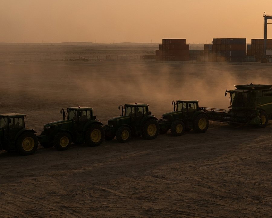 Agricultural machinery staged in an equipment yard before export